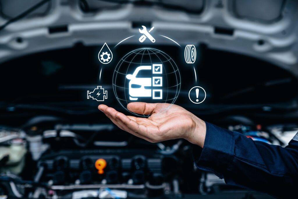 Hand of mechanic holding car service and checking