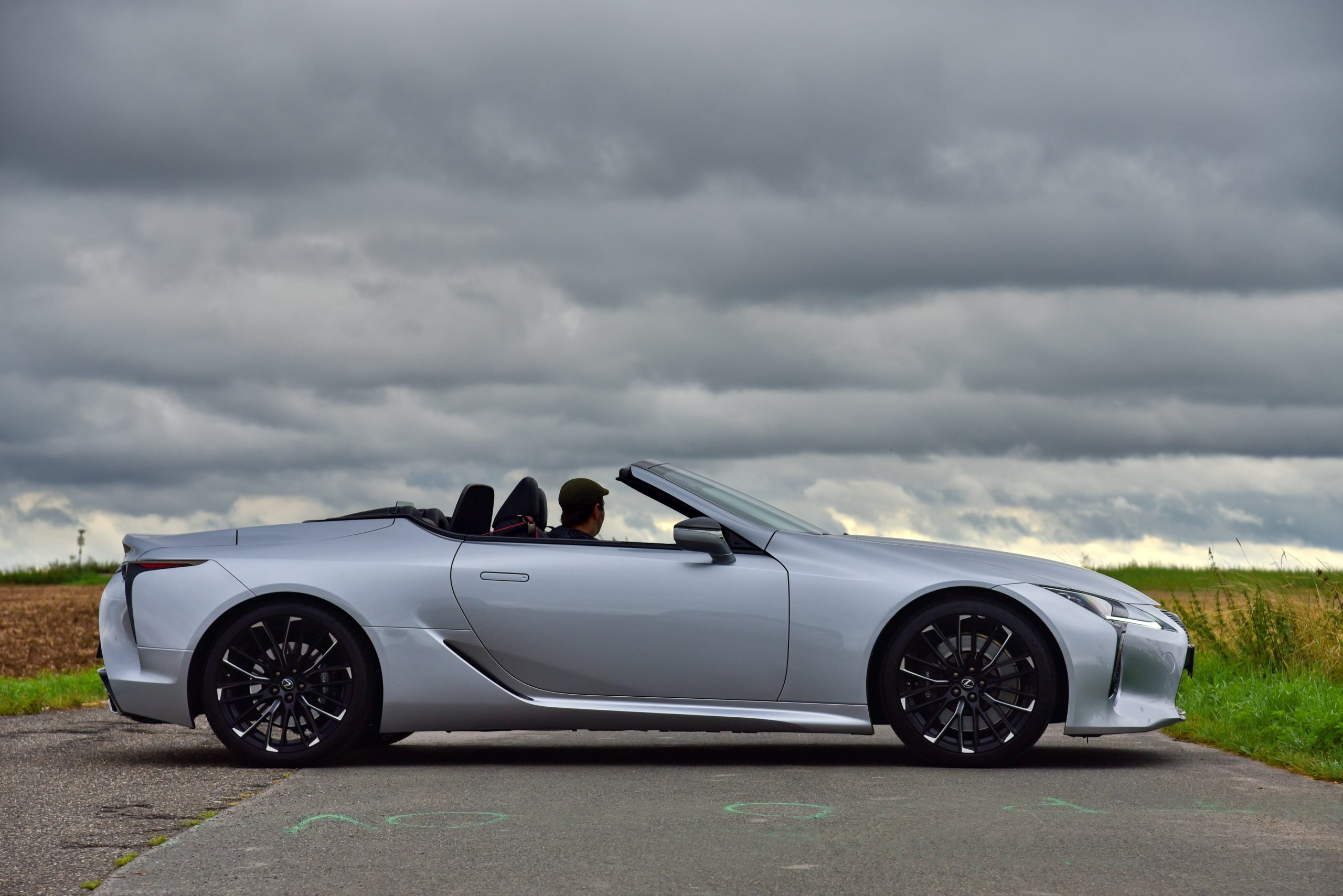 Lexus LC 500 Convertible. A luxury sports car powered by a powerful eight-cylinder internal combustion engine. General side view. 08-29-2023, Middle Bohemia, Czech Republic.